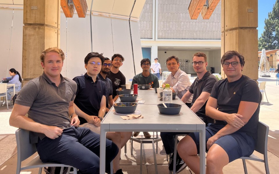 Graduate students and researchers at a group lunch on campus