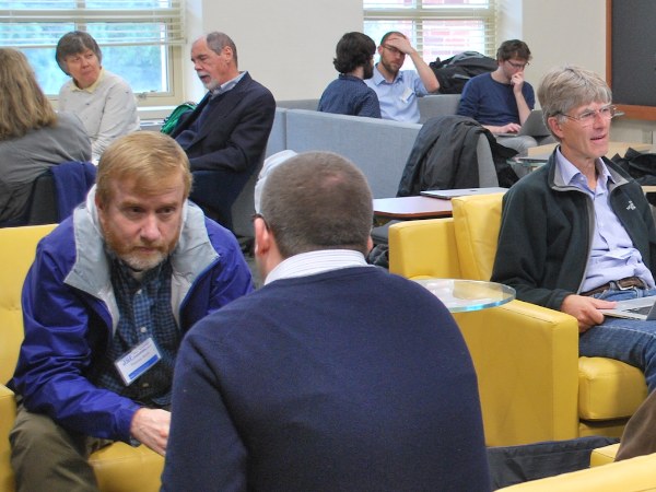 Participants talking in the Schwinger Lounge during Schwingerfest